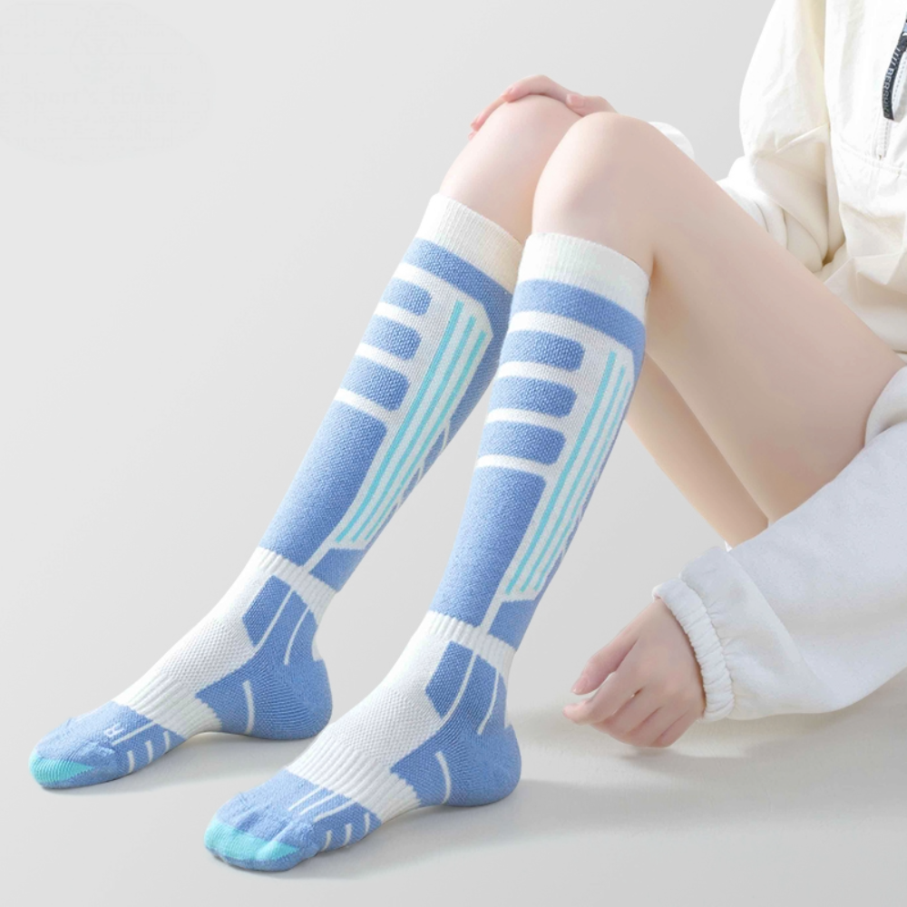 Breathable women’s ski socks with ventilation mesh zones for skiing and snowboarding comfort