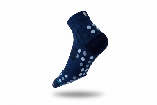 Running grip socks with knitted traction knots for superior grip